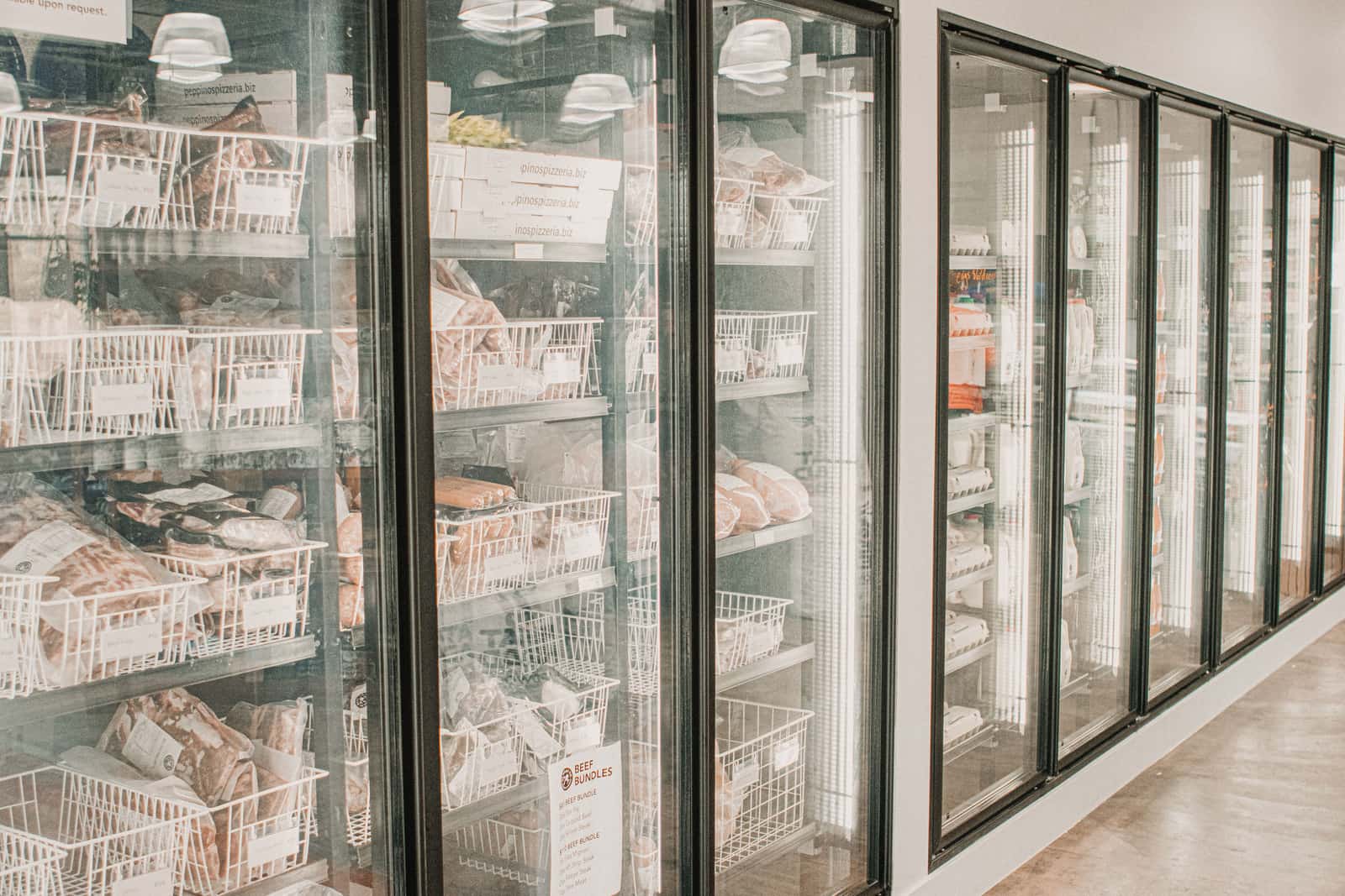 Packaged frozen meat organized on freezer shelves